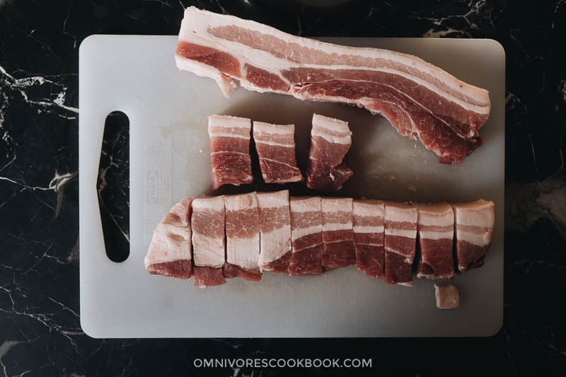 Hong Shao Rou | A Chinese classic. The tender, juicy pork is coated in a glossy sauce that is sticky, savory, sweet, and full of fragrance. It’s a perfect meal-prep dish to cook on a weekend and enjoy throughout the week. How to cut pork belly for braising