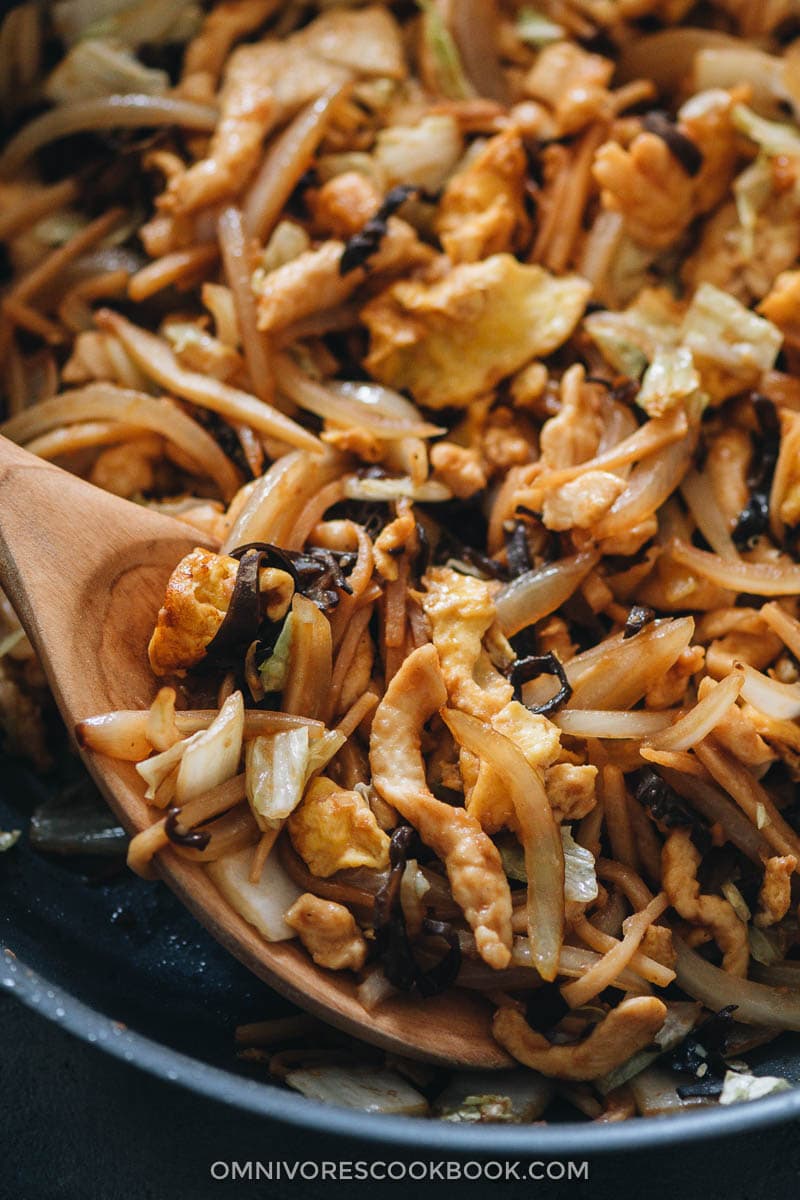 Moo Shu Chicken | A hybrid of authentic Chinese and American Chinese food, moo shu chicken makes a refreshing and delicious dish that’s better than the Chinese restaurant version. Tender juicy chicken, crisp napa cabbage, crunchy bamboo shoots, and wood ear mushrooms are quickly cooked in a savory and lightly sweet sauce. Serve either with moo shu wrappers or steamed rice and you’ll have a healthy and delicious meal. Moo shu chicken close-up