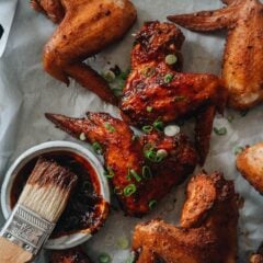 Learn how to make Chinese baked hot wings that have a crisp outer texture with a savory spicy heat. They&rsquo;re perfect for game days, parties, or any time you&rsquo;re craving wings. Brush them with my homemade honey hot sauce - they are literally finger-lickering good!
