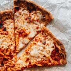 My homemade easy kimchi pizza recipe takes your favorite comfort food to a whole new level with a rich and spicy sauce you&rsquo;ll crave! {Vegetarian}