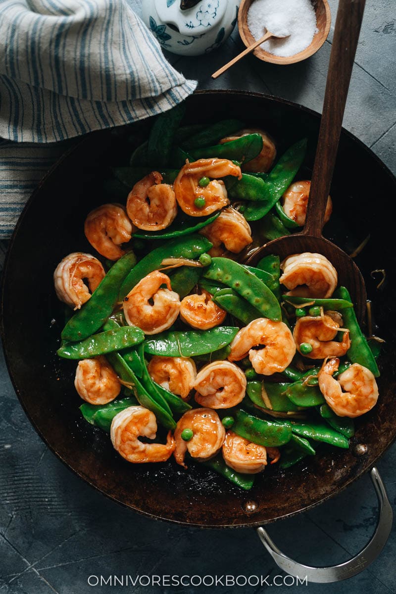 Stir fried shrimp with snow peas in a skillet