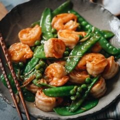 Juicy, tender shrimp with crispy snow peas in a refreshing and healthy gingery sauce. It&rsquo;s a comforting Chinese takeout dish you can whip up quickly any night of the week! {Gluten-Free Adaptable}