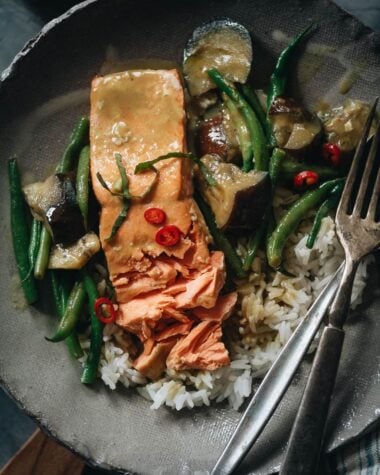 Salmon with green curry over rice