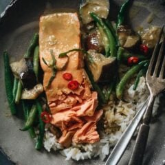 Delicious and balanced, this salmon curry features crispy skin and plenty of veggies in a creamy green coconut curry inspired by Thai cuisine. {Gluten-Free}