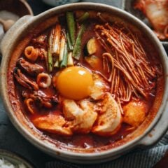 Take your taste buds to Korea with sundubu-jjigae, a delightfully spicy tofu stew that will bring you comfort and warmth in every bowl!