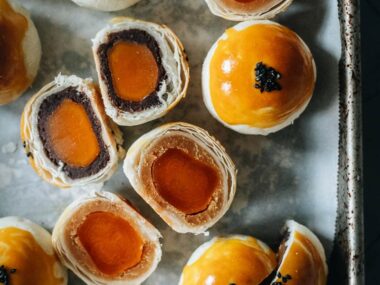 Modern mooncake with red bean and lotus seed paste and egg yolk