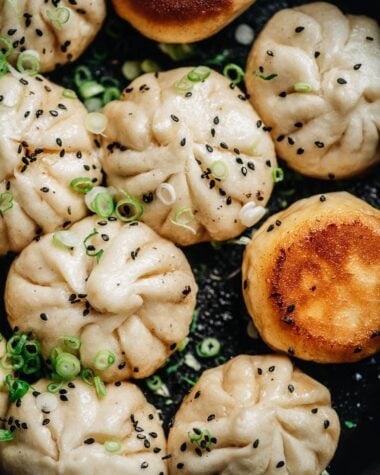 Sheng Jian Bao garnished with sesames and green onion