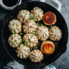 Try this recipe for sheng jian bao (Shanghai pan fried buns) - super juicy and incredibly flavorful pork stuffed into a fluffy yet crispy pan-fried wrapper that satisfies on every level.