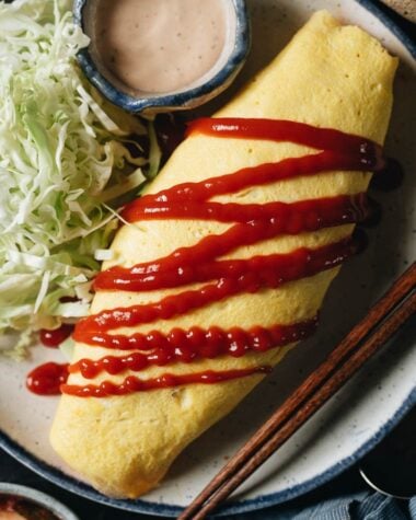 Kimchi fried rice omelet with tomato ketchup and cabbage salad