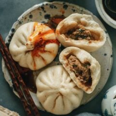 These steamed pork buns are the real deal, both comforting and irresistible. They’re fluffy and filled with rich pork, Chinese chive, and a touch of ginger, making them extra juicy and super flavorful.