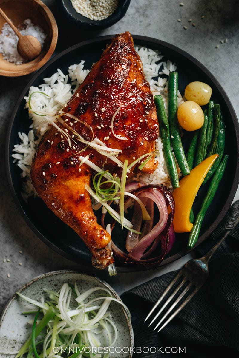 Honey soy glazed chicken thigh over rice with roasted vegetables