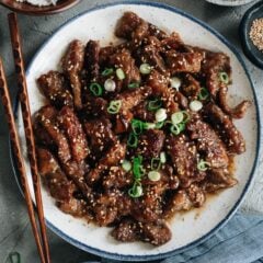 Super juicy and flavorful, you&rsquo;ve got to make sesame beef tonight! It&rsquo;s made with less oil than at a Chinese restaurant, so you can savor the flavor in a healthier way! {Gluten-Free Adaptable}