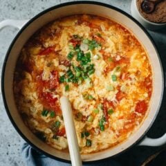 Add this quick and colorful tomato egg drop soup to your homemade Chinese takeout night menu! The aromatics and tomatoes are sauteed to release the fragrance, then cooked with egg ribbons in chicken broth with nutty sesame oil to finish it up. It is comforting and delicious and will warm your heart on a chilly day. {Gluten-Free, Vegetarian-Adaptable}