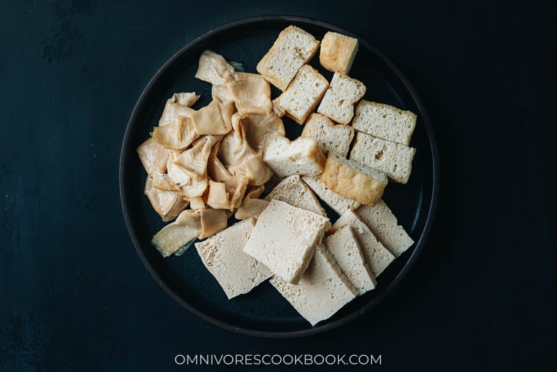 Frozen tofu, fried tofu and yuba knots on a plate