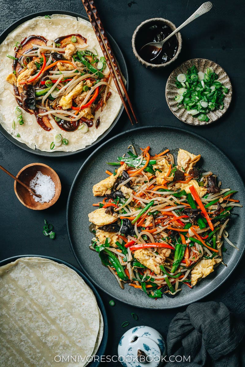Homemade vegetarian moo shu served with sauce and pancakes