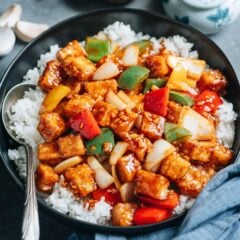 Extra crispy sweet and sour tofu served with crunchy, colorful vegetables and a rich, sticky sauce makes a delicious Chinese dinner! The result is so good that you won&rsquo;t want to order takeout again. {Vegetarian, Vegan, Gluten-Free Adoptable}