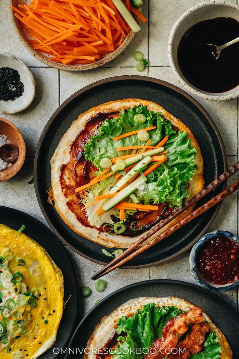 Chinese breakfast egg pancakes with lettuce, cucumber and carrot