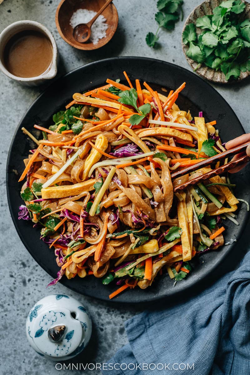 Potato noodles in sesame sauce with vegetables and eggs