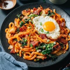 Super quick and easy bacon kimchi fried udon that uses less than ten ingredients to create a satisfying meal that&rsquo;s loaded with flavor. The thick, chewy udon is stir fried with crispy bacon and tender kale and brought together with a spicy sauce. It&rsquo;s a perfect one-pan meal for any time of day!