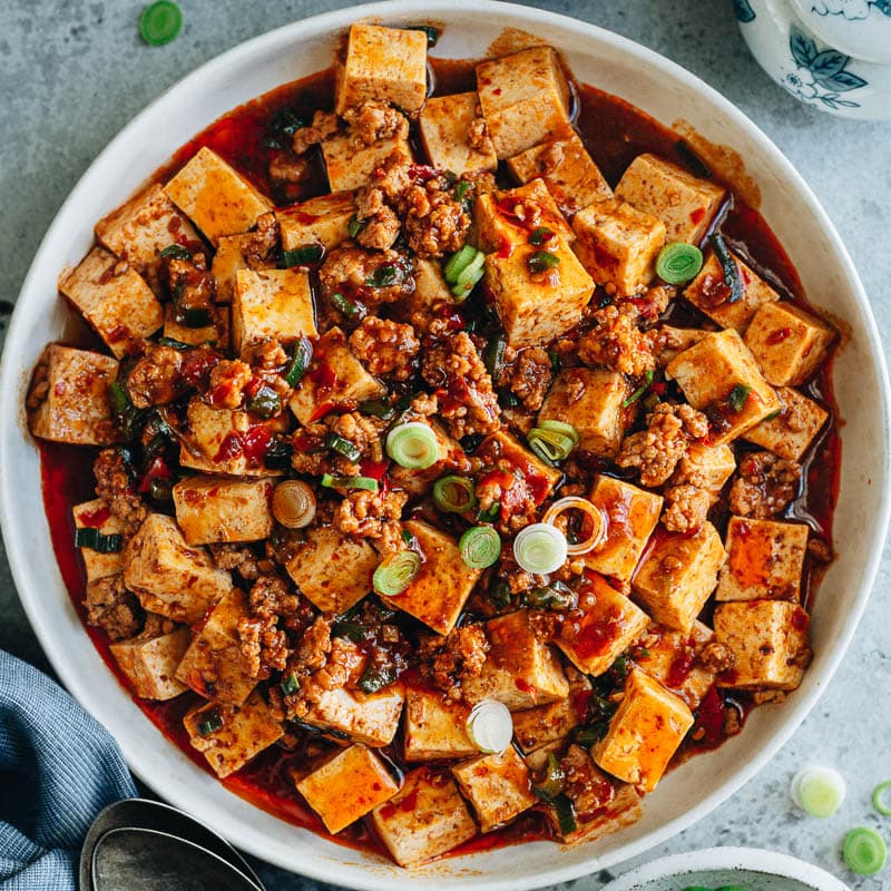 An easy mapo tofu recipe that creates the authentic taste of China and features soft tofu cooked in a rich, spicy, and savory sauce that is full of aroma. Serve it over steamed rice for a quick, delicious and healthy weekday dinner!