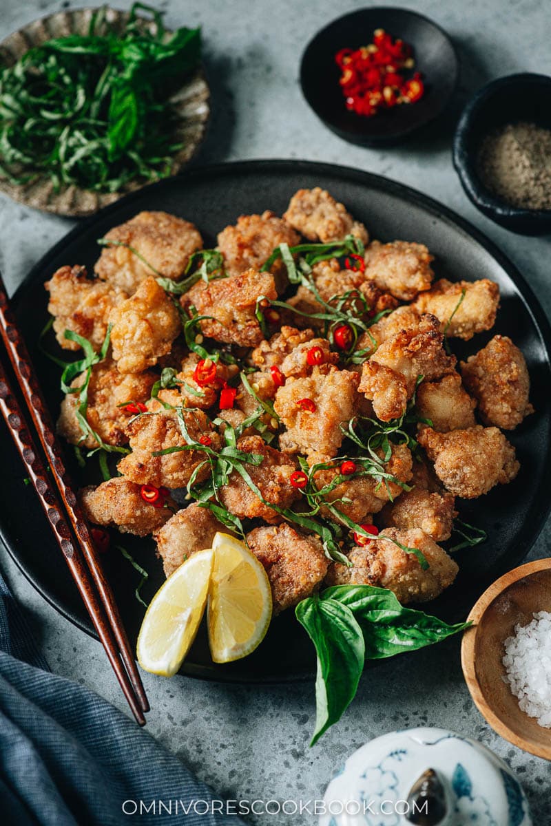 Air fryer salt and pepper chicken with basil, pepper and lemon
