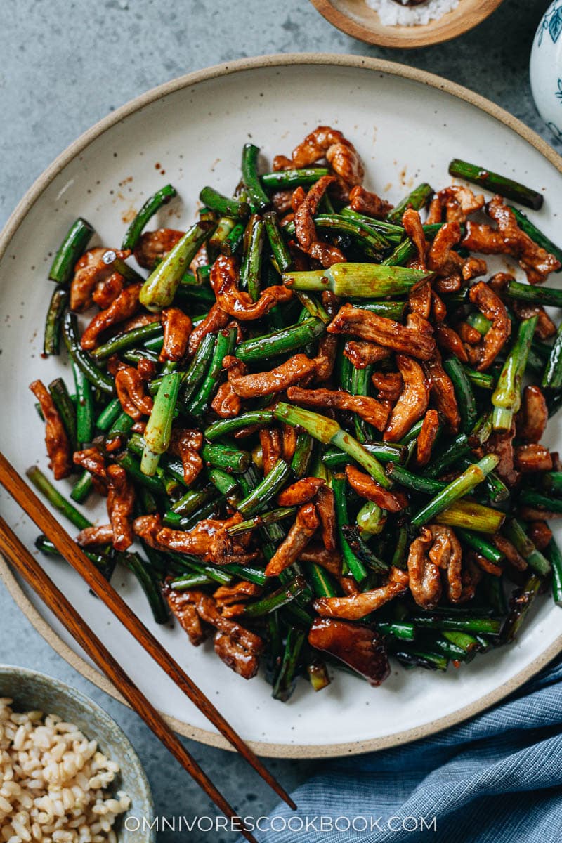 Garlic scape stir fry with pork close up