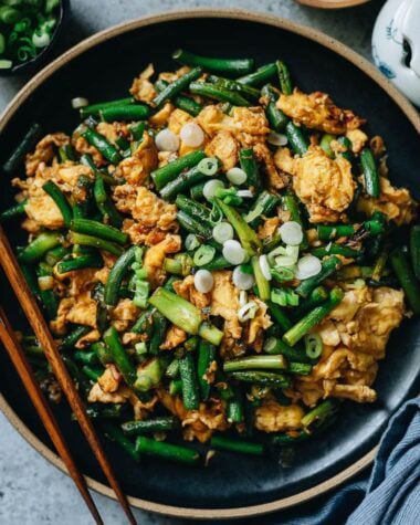 Stir fried garlic scape with scrambled eggs close up