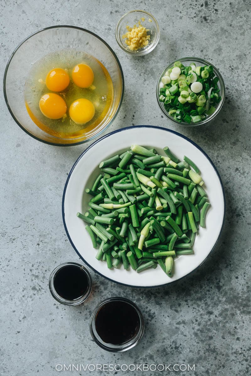 Ingredients for making stir fried garlic scape with scrambled eggs