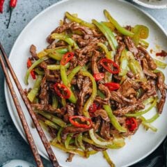 Shredded beef and pepper stir fry features tender juicy beef and crisp peppers cooked with a spicy savory sauce. It&rsquo;s easy to prepare and has a very bold flavor. Serve it over steamed rice - it&rsquo;s a perfect weekday dinner that is super appetizing and healthy.