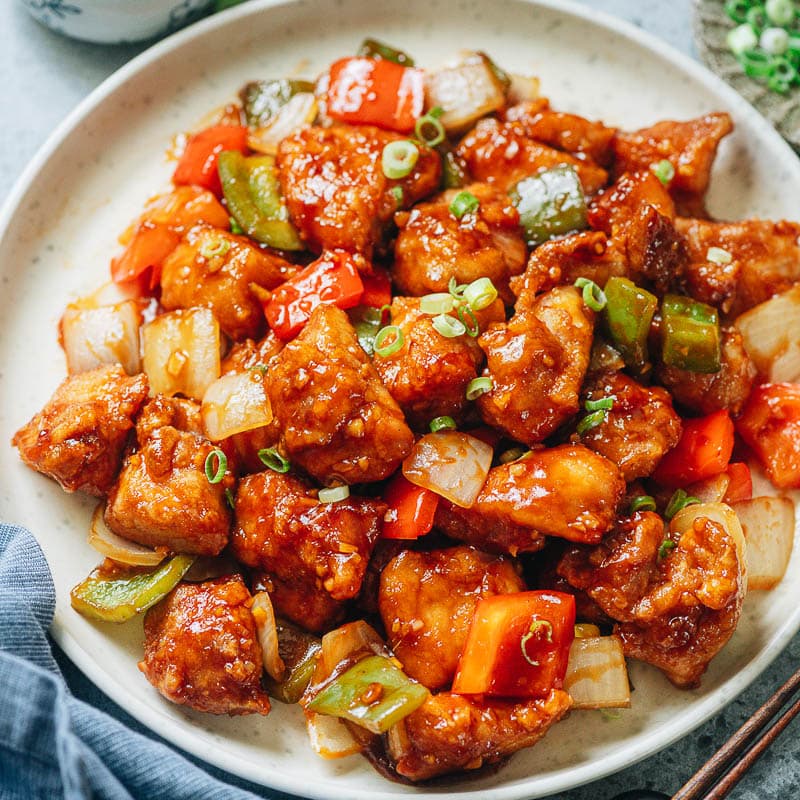 Better than takeout air fryer sweet and sour chicken that has crispy juicy chicken and crunchy vegetables served with a rich sauce. It&rsquo;s so easy to put together, uses way less oil than the regular version, and tastes so great! {Gluten-Free Adaptable}