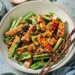 Sharing a super easy tofu and celery salad that is perfect for hot summer days. The tender tofu and crisp celery are mixed with a savory and tart dressing with plenty of aromatics and heavenly chili oil, using minimal ingredients to create maximum flavor! It’s a perfect dish for making ahead too because it tastes even better the next day. {Gluten-Free Adaptable, Vegan}
