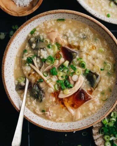Homemade century egg congee with chicken topped with fried shallot