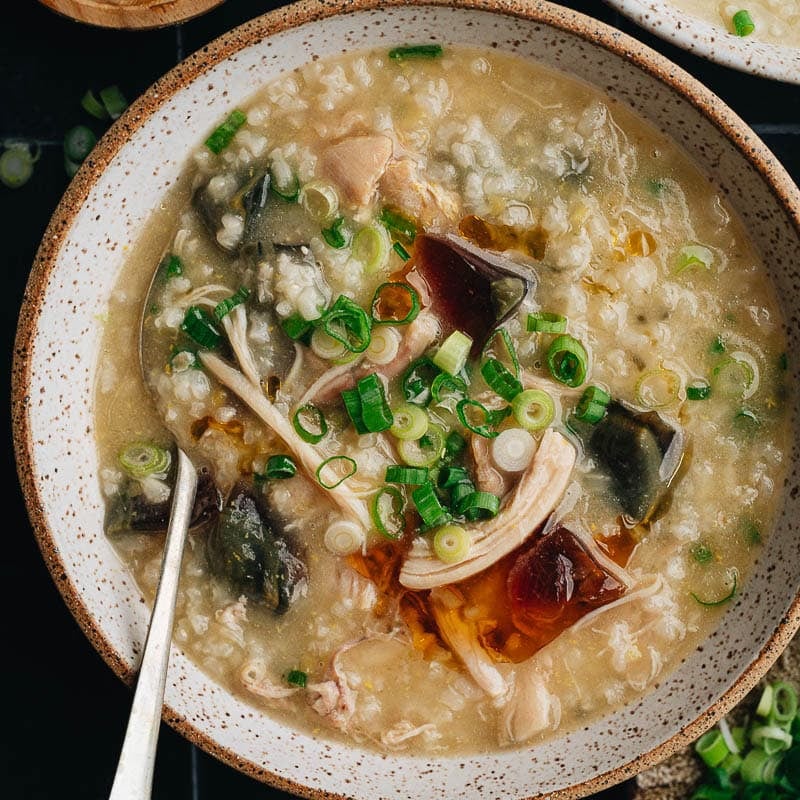 Classic century egg congee made in the Instant pot to get extra creamy congee with tender chicken with just 5 minutes prep. A stovetop version is included as well. {Gluten-Free adaptable}