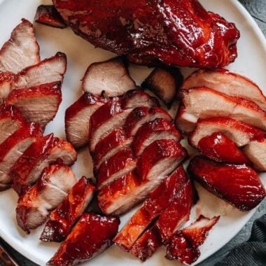 Carved air fryer char siu pork in a platter close up