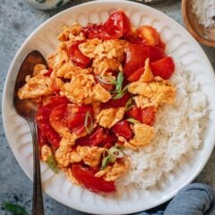 Tender tomatoes and scrambled eggs are stir fried with aromatics and very simple seasonings and served with rice. It&rsquo;s a super hearty and healthy meal that takes 10 minutes to throw together and it tastes so satisfying. {Vegetarian, Gluten-Free}