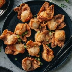 These fried wontons are crispy little flavor bombs! They are packed with shrimp, pork, and fresh aromatics and they&rsquo;re a ton of fun to eat. Impress your guests by serving them as an appetizer at your next party with the included spicy dipping sauce. As a bonus - you can even make them in the air fryer!