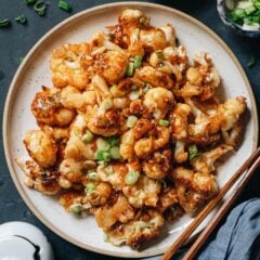 An easy orange cauliflower recipe that creates crunchy crispy cauliflower bites without deep-frying, and a tangy orange sauce that is delightfully fragrant. It is a takeout style dish that you can put together quickly in your kitchen and it’s so satisfying to eat. {Vegan, Gluten-Free Adaptable}