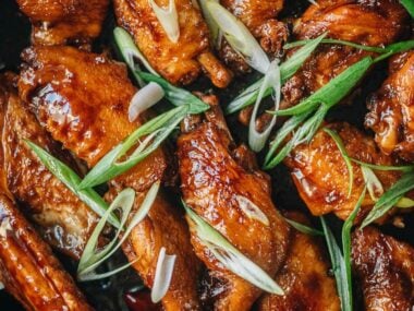 Coca-Cola chicken wings in a pan close up