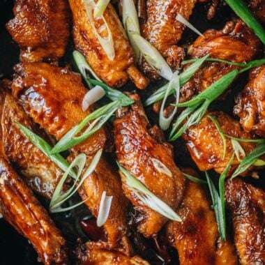 Coca-Cola chicken wings in a pan close up