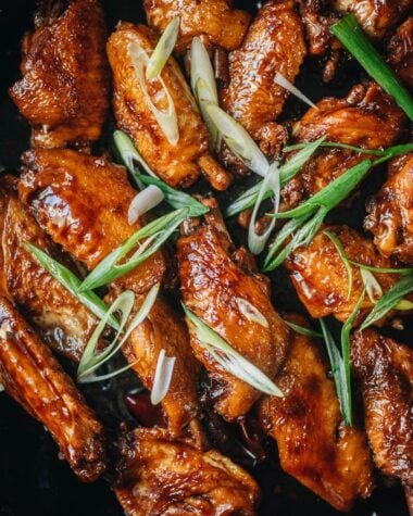 Coca-Cola chicken wings in a pan close up