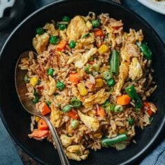 An easy vegetable fried rice that you can cook in 10 minutes and it is bursting with flavor. It is a great choice, no matter whether you're preparing a healthy side or a one-bowl dinner. {Vegetarian, Gluten-Free Adaptable}