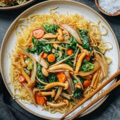 These Vegetable pan fried noodles are a perfect one-bowl weeknight dinner! The crispy noodles are covered with colorful vegetables that come in all textures and a rich savory sauce. {Vegetarian, Vegan}
