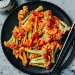 This quick and easy stir fried cauliflower with tomato features crunchy cauliflower covered in a sweet and sour tomato sauce. It is a side dish that&rsquo;s easy to put together and brings big flavor to your table. {Gluten-Free, Vegan}