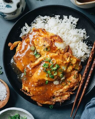 Chinese omelet over white rice with gravy