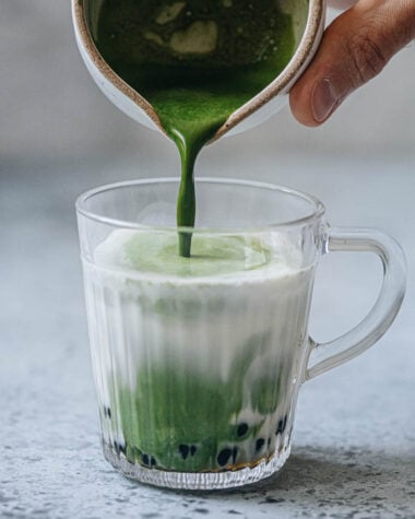 Pouring matcha to make matcha bubble tea