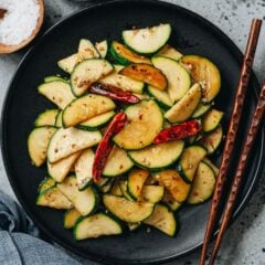My Chinese zucchini stir fry is a fantastic homestyle dish that is quite simple to make. The summer squash is sauteed in Sichuan peppercorn oil to add a bold, vibrant flavor that makes the zucchini really come alive. {Gluten-Free Adaptable, Vegan}