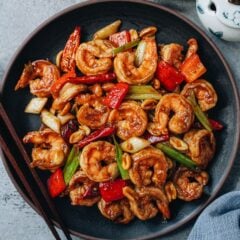 Authentic tasting kung pao shrimp featuring tender juicy shrimp cooked with a spicy, sweet, sour and savory sauce with crunchy peppers and peanuts. Colorful, satisfying, and bursting with a well-balanced spiciness, it is the dish you need to whip up for dinner tonight! {Gluten-Free adaptable}