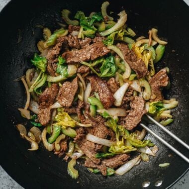 Stir fried beef and celery in a wok