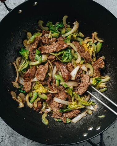 Stir fried beef and celery in a wok