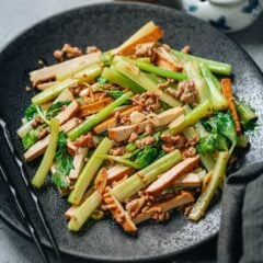 Dried tofu and celery stir fry is a satisfying and healthy main dish that you can put together in no time. The crunchy celery and chewy smoked tofu are cooked with a small amount of ground pork to enhance their flavor, along with ginger, garlic and soy sauce. It&rsquo;s super easy to make and tastes very satisfying! {Gluten-Free Adaptable, Vegetarian Adaptable}